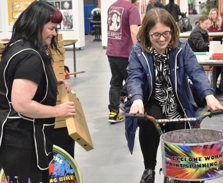 2Kirsty Winterton from Cycolne Works helps a staff member from the EEG create art work through peddle power